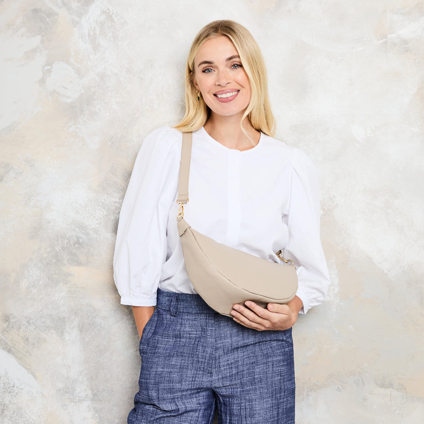 Model Image of a Biscuit Beige Leather Hobo bag with matching strap for Women by Elie Beaumont