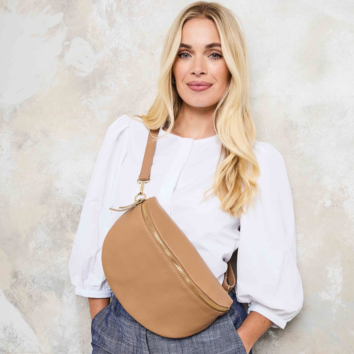 Model Image of a Large Camel Leather Slingbag for Women by Elie Beaumont
