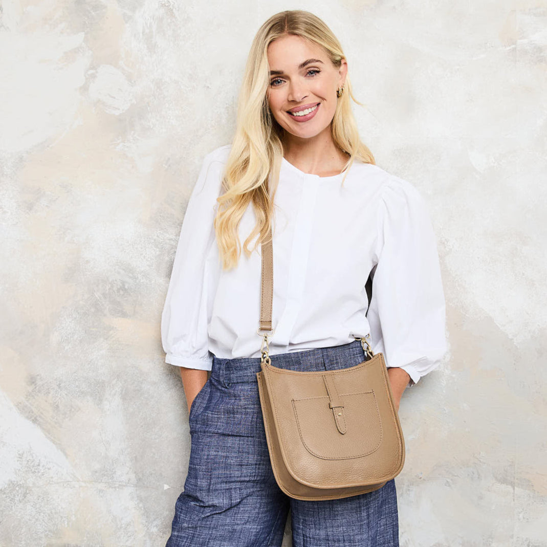 Model Image of a Cappuccino Brown Leather Messenger bag with matching strap for Women by Elie Beaumont