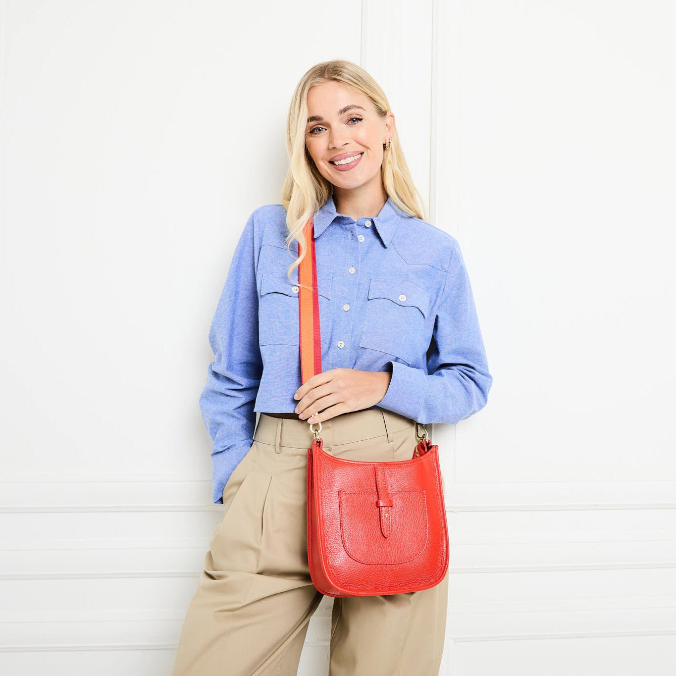 Model Image of a Coral Orange Leather Messenger bag with matching strap for Women by Elie Beaumont