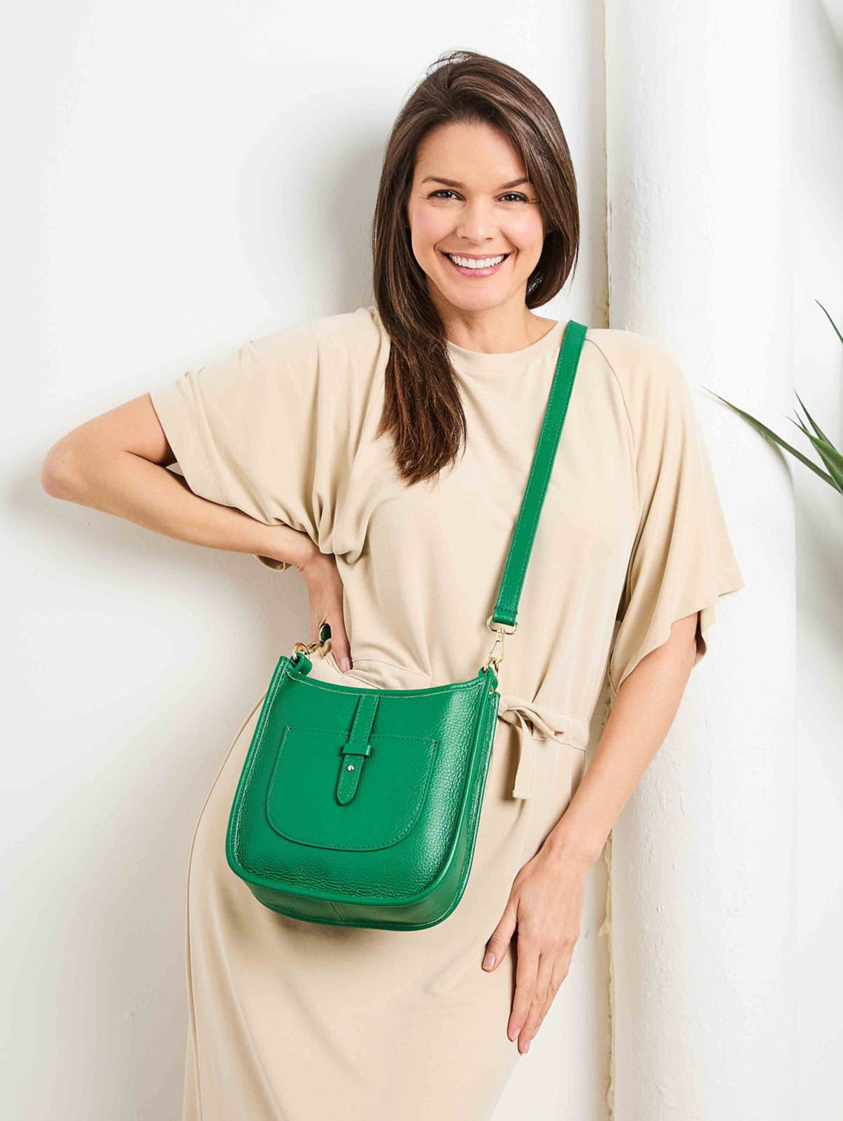 Model Image of an Emerald Green Leather Messenger bag with matching strap for Women by Elie Beaumont