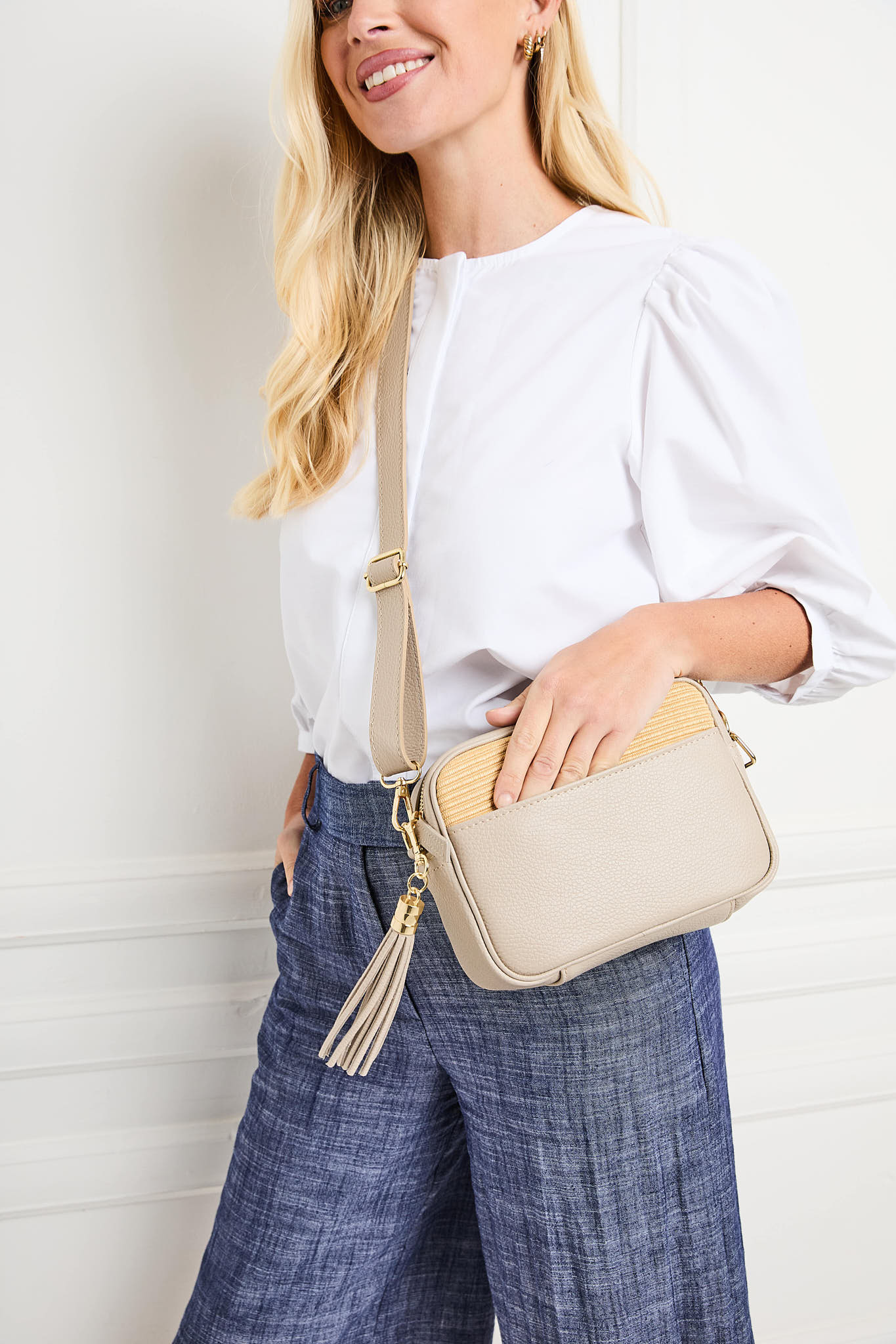Model Image showing the pocket of Biscuit Beige Raffia Tassel Leather Bag for Women by Elie Beaumont