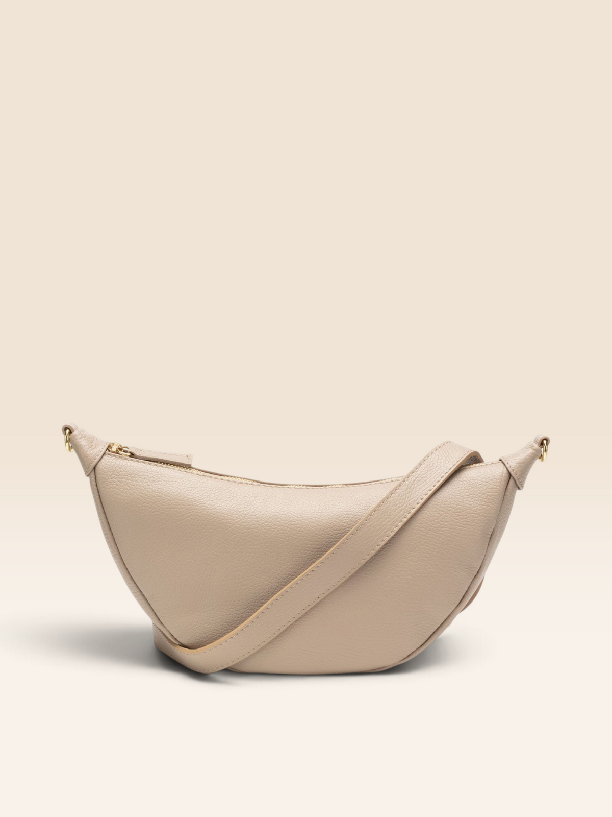 Image of a Biscuit Beige Leather Hobo Bag with matching strap for Women by Elie Beaumont