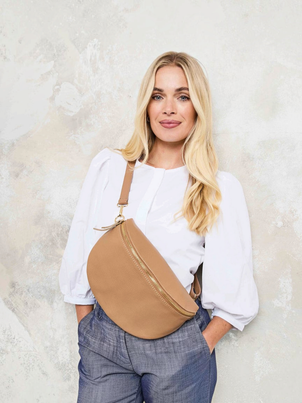 Model Image of a Large Camel Leather Slingbag for Women by Elie Beaumont