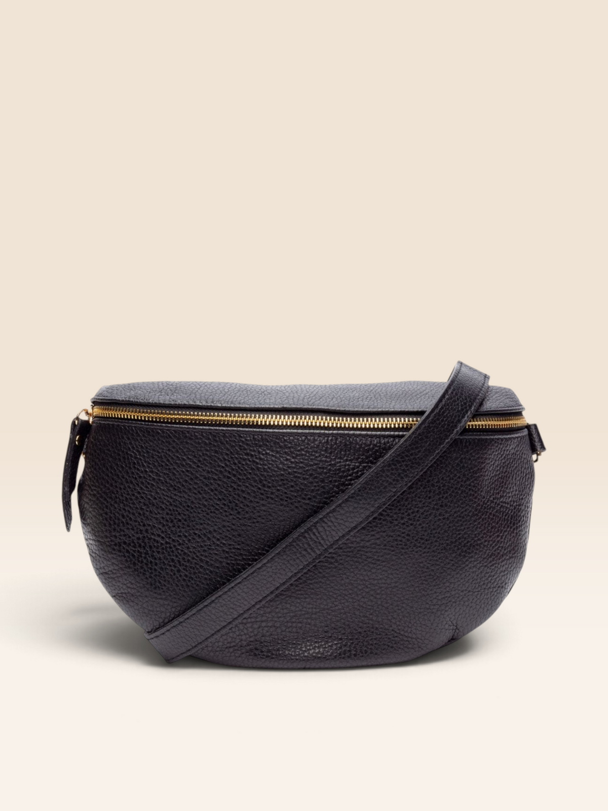 Elie Beaumont London black grained Italian leather sling bag with gold zip detail and matching adjustable strap.